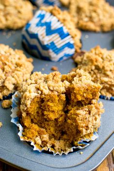 some muffins are sitting on a blue tray