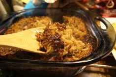 a casserole dish with meat and rice in it