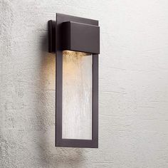 an outdoor light mounted on the side of a wall