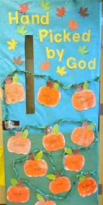 a hand picked by god bulletin board with pumpkins and leaves on it, in front of a classroom door