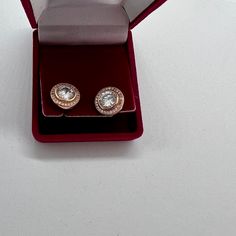 A lovely pair of vintage rose gold plated on silver cubic zirconia faux diamond stud earrings. These pretty earrings have a large faux diamond zirconia stone set at the centre that is circular in shape and measures 7mm making the earring an eye catching statement piece. Each stone is surrounded by a circle of tiny stones giving these earrings a real sparkle. The earring measure 12mm and are circular in shape with butterfly backs. Each earring is marked 925 on the post for silver. The earrings we Rose Gold Cubic Zirconia Diamond Earrings With Sparkling Stones, Formal Rose Gold Earrings With Sparkling Stones, Rose Gold Brilliant Cut Cubic Zirconia Earrings, Formal Rose Gold Earrings With Halo Setting, Rose Gold Diamond Earrings With Halo Setting For Gift, Rose Gold Halo Setting Diamond Earrings, Rose Gold Halo Setting Earrings For Gift, Classic Rose Gold Earrings With Halo Setting, Rose Gold Cubic Zirconia Earrings With Halo Setting