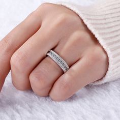 With grace and shimmer, this sparkling band is a classic style that complements her sophisticated taste. As a perfect wedding or anniversary band, it features three tiered rows of shimmering round stones set one atop the other across the center. Lovely worn alone or paired with her wedding rings.Carat Weight: 1.475 ctStone Size: 1.2,2 mmStone Type: Jeulia® StoneNumber of Stones: 55 Stone Color: Diamond WhiteStone Shape: RoundWeight: 5.65 gWidth: 5.4 mmHeight: 2.7 mmThickness: 5.1 mmMaterial: 925 SilverPlating Color: Silver Silver Cubic Zirconia Half Eternity Band, Sparkling Round Band Jewelry For Wedding, Silver Eternity Band With Pave Setting For Wedding, Baguette Cut Sparkling Jewelry For Wedding, Sparkling Baguette Cut Jewelry For Wedding, Silver Wedding Bands With Channel Set, Silver Wedding Bands Channel Set, Sparkling Baguette-cut Jewelry For Anniversary, Elegant Silver Channel Set Bands