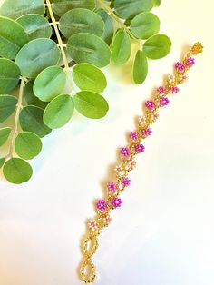 The Flores bracelet has been a top seller! Mini flowers dot along a beautiful beaded vine. They all feature a bead and 2 loop closure (for adjusting to the right size). These bracelets are perfect gifts for graduating seniors. They also look great stacked with other bracelets. All are 7" from end to end. Ethically Handmade in Mexico by Dani and her family. They are Otomí artisans. Adjustable Crystal Bracelet For Spring Gifting, Adjustable Crystal Bracelet As Spring Gift, Adjustable Crystal Bracelet For Spring Gift, Spring Crystal Bracelet Gift, Adjustable, Spring Beaded Chain Jewelry Gift, Elegant Adjustable Crystal Bracelet For Spring, Adjustable Spring Crystal Bracelet With Flower Shape, Spring Gold Beaded Bracelets With Colorful Beads, Adjustable Flower Crystal Bracelet For Spring