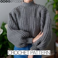 a woman wearing a gray knitted sweater with her hands on her hips and the words crochet pattern below it