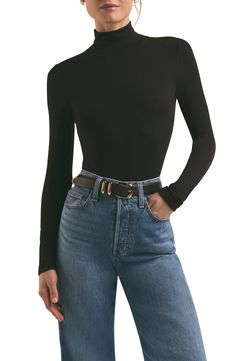 Channel effortlessly chic off-duty style in this stretchy ribbed top fashioned with long sleeves and a mock neck. 22" length (size Medium) Mock neck Long sleeves 97% modal, 3% elastane Machine wash, line dry Imported Black Long Sleeve Turtle Neck Shirt, Black Mock Neck Top Outfit, Mock Neck Top Outfit, Ruffle Tops Outfit, Early Fall Fashion, Virgo Rising, High Neck Long Sleeve Top, Nyc Outfits, Mock Turtle Neck