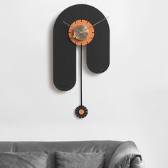 a clock that is on the wall above a couch