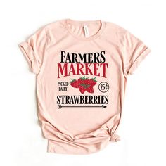 Looking for a cute versatile top to wear this summer? Make sure to grab one of our Farmers Market Strawberries tees! This soft and comfortable graphic tee is the perfect top for any outfit. It can be paired with biker shorts, jeans, or even a simple skirt/dress! This tee is true-to-size, so be sure to order your regular t-shirt size! If you are looking for a more oversized look, make sure to size up! Sunflower Shorts, Female Farmer, Simple Skirt, Women Best, Graphic Apparel, Shorts Jeans, Sleeves (women), Skirt Dress, Biker Shorts