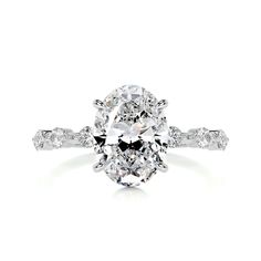 an oval cut diamond ring with side stones