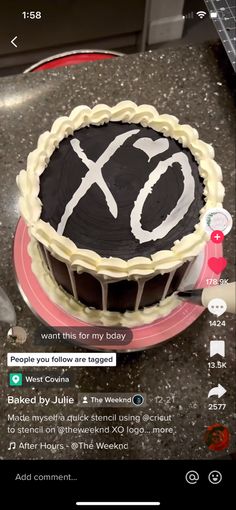 a cake with the word xo on it sitting on top of a countertop