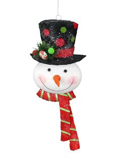 a snowman ornament hanging from a string on a white background with red and green decorations