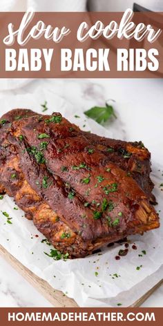 slow cooker baby back ribs with parsley on top and text overlay that reads slow cooker baby back ribs