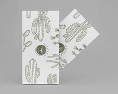 two greeting cards with cactus designs on them