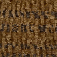 a brown and black textured fabric with words written on the side in cursive writing