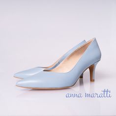 "Beautiful pumps made of high-quality grain leather set on a slim, comfortable heels. Stylish classic model in  on a heel are a proposition for women who value classic elegance and comfort of use The insole made of a soft calfskin ensures comfort of use. Slim sole and delicately pointed toes optically slim the feet.  Classic pumps with a simple cut without unnecessary decorations are a basic element of everyday, business and evening outfits. Whatever your style, the pumps will look just as good with wedding dress, casual outfit and jeans. BRAND: Anna Maratti MATERIAL: grain leather LINING: calf leather SOLE: synthetic HEEL HEIGHT: 7 cm = 2.7 \" FIT: regular width Sizes US, EU, UK and feet dimensions 5 US / 36 EU / 3 UK insoles length 23.5 cm = 9.2 inches 6 US / 37 EU/ 4 UK insoles length 2 Leather Wedding Shoes With 4-inch Open Heel, Leather Kitten Heels With 4-inch Heel For Wedding, Classic Wedding Shoes With Removable Insole And Pointed Toe, Fitted Almond Toe Leather Shoes For Wedding, Elegant Fitted Almond Toe Court Shoes, Classic Blue Heels With 4-inch Heel, Leather Kitten Heels With Sculpted Heel For Wedding, Wedding Heels With Leather Sole And Round Toe, Wedding Heels With Leather Sole And Almond Toe