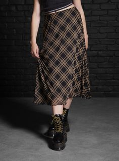 Mix up your plaid skirt rotation with this midi style. It has a mesh overlay printed with black and brown plaid. It's fully lined with an elastic waistband.95% polyester; 5% spandexWash cold; dry lowLength: 29''ImportedListed in junior sizes Alt Winter Outfits, Houska Castle, Skirts Hot, Social Collision, Plaid Midi Skirt, Tall Hoodies, Alt Fashion, Mesh Overlay, Brown Plaid