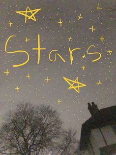 the words stars are written in bright yellow on a dark gray background with trees and buildings