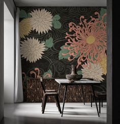 a dining room table with two chairs and a vase on top of it in front of a floral wallpaper