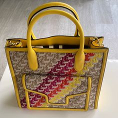 New Ralph Lauren Yellow Multi Color Handbag W Detachable Shoulder Strap. $595. L: 12.5”. H: 12.5”. D: 4”. Designer Yellow Bag With Top Carry Handle, Luxury Yellow Crossbody Satchel, Designer Yellow Satchel With Removable Pouch, Luxury Yellow Bag With Top Carry Handle, Designer Yellow Satchel With Handles, Designer Yellow Rectangular Shoulder Bag, Luxury Yellow Shopping Bag, Yellow Rectangular Bag With Branded Hardware, Yellow Rectangular Bags With Branded Hardware