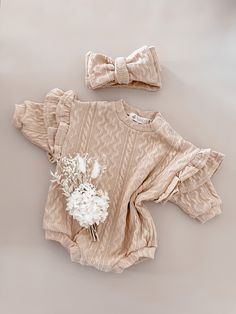 The romper of your dreams has finally landed! Say hello to the all new BABY O ORIGINAL DESIGN Frilly Romper! With stunning detail throughout the Romper fabric and statement frills on the shoulders, this romper is perfect for any occasion! The Frilly Romper has a beautiful matching bow (sold separately) to complete the look! Spring Beige Bubble Romper With Ruffles, Cute Cream Bubble Romper With Ruffles, Cute Beige Ruffled Bubble Romper, Cute Beige Bubble Romper With Ruffles, Cream Long Sleeve Bubble Romper For Summer, Long Sleeve Cream Onesie For Summer, Cream Long Sleeve Onesie For Summer, Cream Long Sleeve Summer Onesie, Oversized Romper