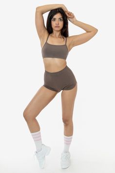 These cheeky hot shorts have a vintage, sporty-inspired look. Made of our heavyweight cotton spandex, these shorts feature a multi-needle elastic waist and curved dolphin hem and have been garment dyed for a rich, smooth finish. Pair with our matching 83016GD Spaghetti Bralette or any of our rib tanks for a timeless look. Perfect for at-home workouts or roller skating by the beach. Runs small, we recommend sizing up one size if you are in between sizes. Made in South Central, Los Angeles. Our ex Sporty Crop Top With Built-in Shorts, High-waisted Cotton Shorts For Gym, Stretch Crop Top With Built-in Shorts, Stretch Cotton High-waisted Shorts Activewear, Stretch Cotton High-waisted Activewear Shorts, Athleisure Short Crop Top For Loungewear, Short Athleisure Crop Top For Loungewear, Athleisure Short Length Crop Top For Loungewear, Sporty Seamless Short Boxer Briefs