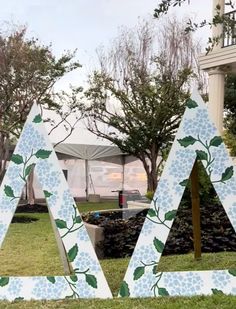 the letters are decorated with flowers and leaves