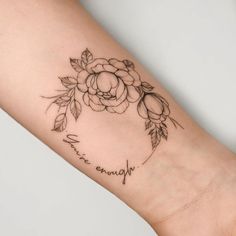 a woman's arm with a tattoo on it that reads, always and flowers