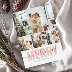 a christmas card on top of a blanket next to pine cones