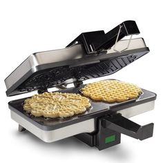 an electric waffle maker with three different types of waffles on it