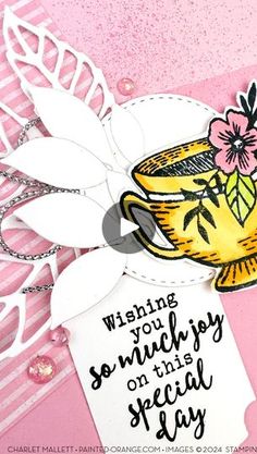 a close up of a card with a flower and cup on the front, which reads wishing you so much on this special day