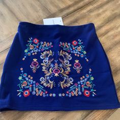 Pretty Blue Skirt With Embroidery. Nwt. Size Large. Blue Embroidered Stretch Bottoms, Blue Embroidered Mini Skirt, Summer Blue Skirt With Floral Embroidery, Casual Blue Skirt With Floral Embroidery, Fitted Blue Skirt With Floral Embroidery, Blue Skirt With Floral Embroidery For Summer, Blue Floral Embroidered Skirt For Summer, Embroidered Blue Mini Skirt, Casual Embroidered Blue Skirt