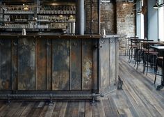 an old bar with wooden floors and bars