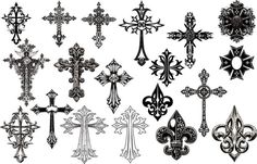 an assortment of different crosses on a white background