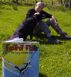 a man sitting in the grass with his dog next to a book titled footloof flats