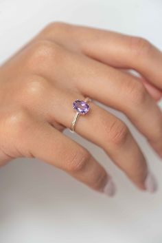 Add a hint of color to your jewelry collection with our classic oval Amethyst ring handmade in 925 silver and gold vermeil. Our Amethyst ring features a single 8x6mm light purple genuine Amethyst set in a four-prong silver setting on a 2mm sturdy silver band. D E T A I L S * Stone size - Medium - 8mm x 6mm, Large - 10mm x 8mm * Materials - 925 sterling silver, natural genuine light purple Amethyst * Also available in 18k Gold Vermeil here - https://www.etsy.com/listing/849822737/ * Birthstone mo Amethyst Ring Simple, Rings With Purple Stones, Birthstone Ring Design, Silver Ring With Purple Stone, Purple Gemstone Rings, February Birthstone Rings, Silver Stone Rings Women, Silver Ring Designs For Women, Amethyst Ring Designs