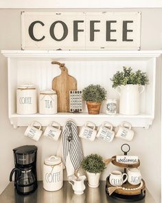 a shelf with coffee cups and mugs on it