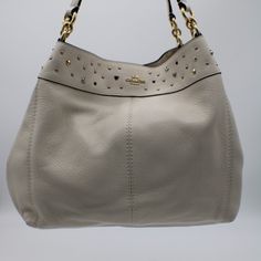 Pebble Leather Inside Zip, Cell Phone And Multi Function Pockets Center Zip Compartment Snap Closure, Fabric Lining Handles With 9.5" Drop\ 13" L X 10.75 H X 5" D. Style Coach 22314 - Lexy Pebble Leather Shoulder Bag In Chalk White Stardust Luxury Embellished Cream Bags, Luxury Coach Hobo Bag With Silver-tone Hardware, Luxury Coach Hobo Bag, New Coach Handbags, Brown Coach Purse, Coach Leather Bag, Canvas Leather Bag, Style Coach, Brown Leather Shoulder Bag