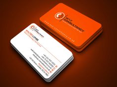 an orange and white business card sitting on top of a table