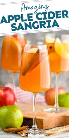 an image of apple cider sangria with apples in the background