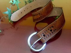 "This vintage handmade genuine leather belt has a classic tooled leather western country style, perfect to complete your cowgirl or cowboy outfit. It is made of high quality thick brown genuine leather with finished edges that enhanced the beauty. It's decorated in a tooled woven style pattern pattern. You can match it with your daily clothes or use it as part of a costume. - Ideal for Size Small (please see measurements below) - Stamped on the leather: \"KEN-228 Genuine Italian Leather Olga San Brown Leather Rodeo Belt, Brown Leather Belt For Rodeo, Rustic Brown Hand-tooled Belt, Rustic Brown Hand Tooled Belt, Brown Hand Tooled Bohemian Belts, Hand-tooled Brown Belt Buckles For Western-themed Events, Brown Hand Tooled Belt Buckles For Rodeo, Hand Tooled Brown Belt Buckles For Rodeo, Western Brown Belt Buckles For Rodeo