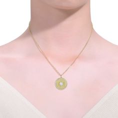 This vintage-inspired medallion pendant necklace features a textured pattern for a luxurious, unique look. A heart-shaped cubic zirconia solitaire takes center stage framed by a halo of cubic zirconias. A delicate cable chain suspends this pendant secured by a lobster clasp, all in brightly polished 14k yellow gold plated. Zodiac Pendant Necklace, Trending Necklaces, Initial Pendant Necklace, Zodiac Pendant, Cross Pendant Necklace, Accessories Jewelry Necklace, Initial Pendant, Center Stage, Gold Pendant Necklace