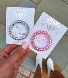 two bracelets and a card with the words to have and to hold