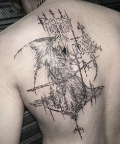 the back of a woman's upper body with an arrow and bird tattoo on it