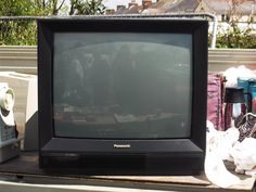 an old television sitting on top of a table