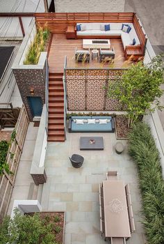 an aerial view of a backyard with patio furniture and outdoor living space in the background