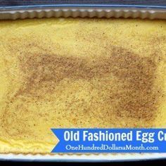 an old fashioned egg cake in a pan with brown sugar on top and blue ribbon around the edges