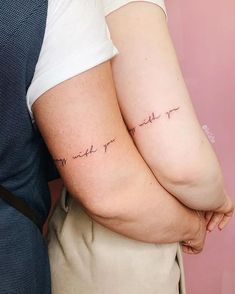 two people with tattoos on their arms that say, i love you and miss you