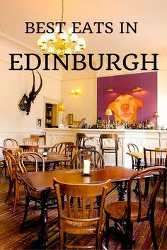 a restaurant with wooden tables and chairs in front of a painting that reads best eats in edinburgh