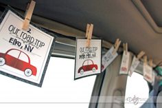 some signs hanging from the side of a car