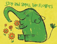 an elephant with flowers in its trunk and the words, stop and smell the flowers