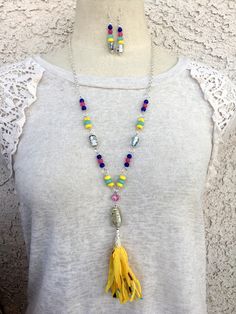 This handmade necklace set is a colorful Bohemian tassel with hand-blown glass beads, semi-precious aquamarine, dyed Quartzite, turquoise, striped agate, and glass beads. The tassel is handmade from cotton fibers. I added silver chain to give it a lariat length. Colorful Bohemian, Bohemian Colors, Necklace And Earrings, Handmade Necklace, Hand Blown Glass, Blown Glass, Handmade Necklaces, Hand Blown, Tassel Necklace